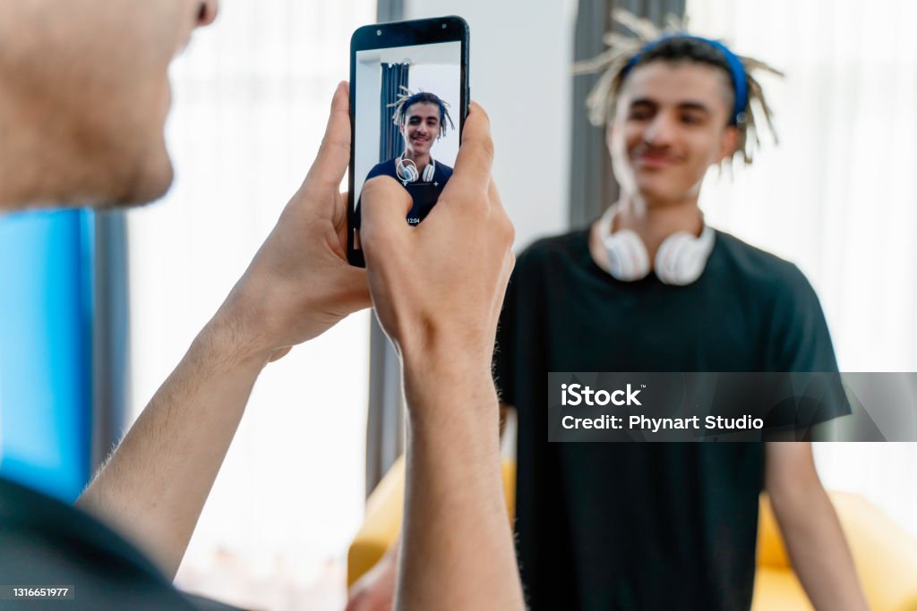 Young teenage boys vlogging Filming Stock Photo