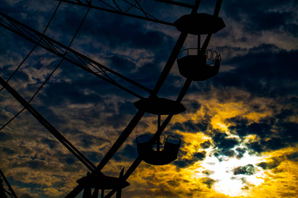 istock Clouds in the Sunset and the Ferris Wheel 1316652071