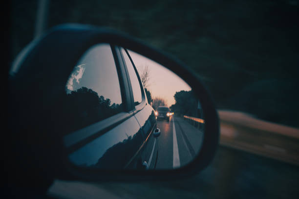 istock Reflection of car in rear view mirror 1316655358