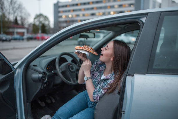istock Business woman eating pizza on lunch break 1316655657