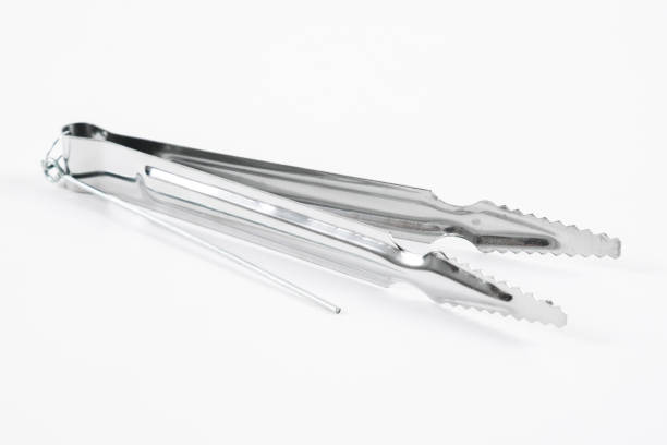istock Metal hookah tongs on a white background. 1316657070