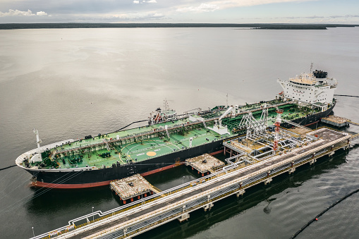 Aerial view of oil tanker unloading in port
