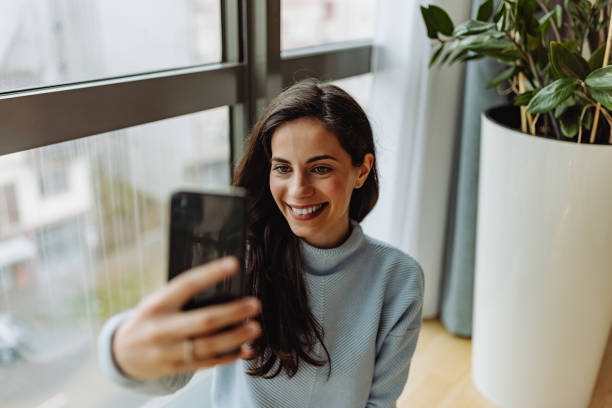 istock Woman using mobile phone, taking pictures. 1316658979