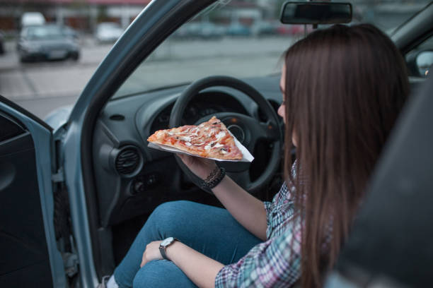 istock Eating pizza on lunch break on parking lot 1316659213