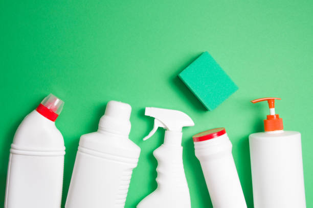 istock green sponges for washing and several different types of white plastic bottles without labels for detergents on a green background top view copy space 1316659460
