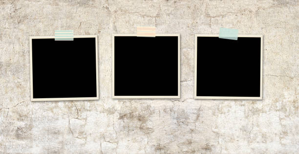 istock Three retro photos on old stucco wall 1316661687
