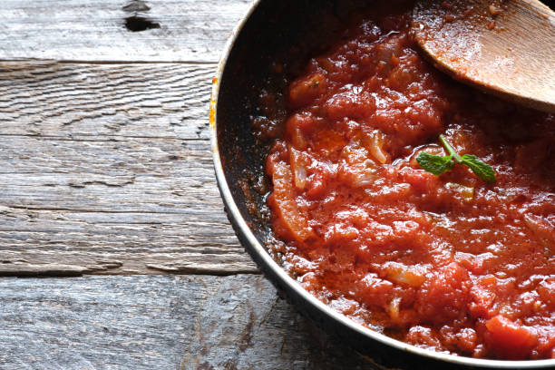 istock Homemade crushed tomato on frying pan 1316664728