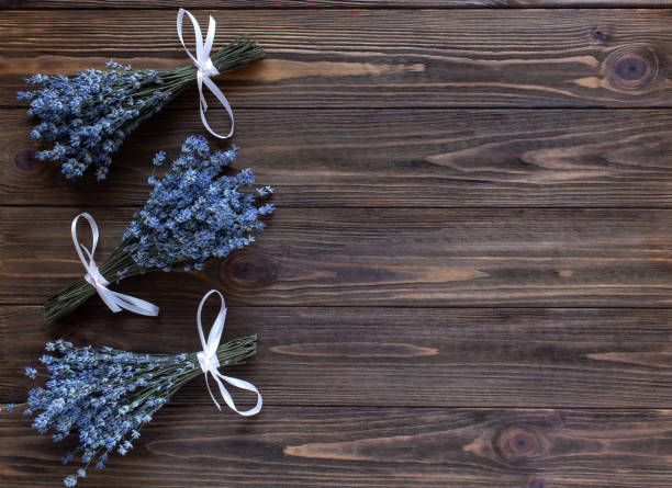 istock Lavender floral frame on dark wooden background. Top view, flat lay, copy space 1316666860