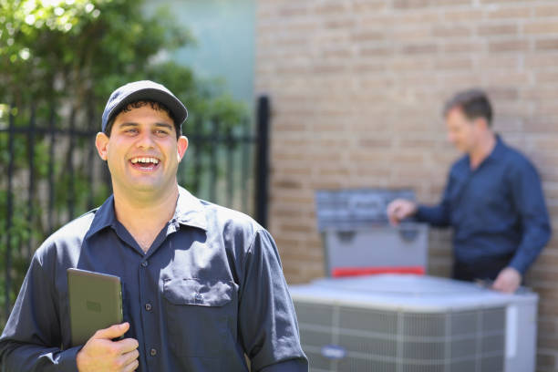 istock Latin descent, blue collar air conditioner repairman at work. 1316667093