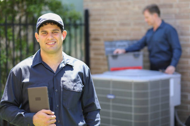 istock Multi-ethnic team of blue collar air conditioner repairmen at work. 1316667171