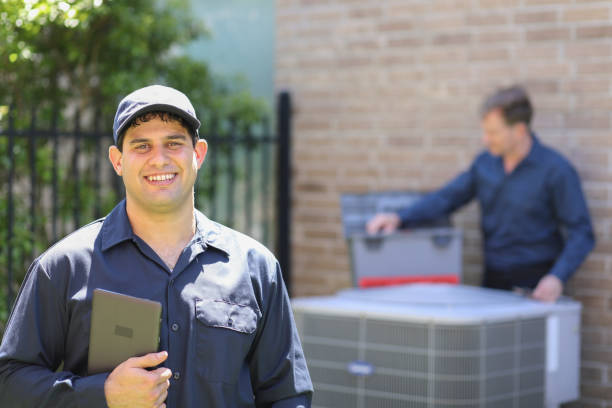 istock Multi-ethnic team of blue collar air conditioner repairmen at work. 1316667198
