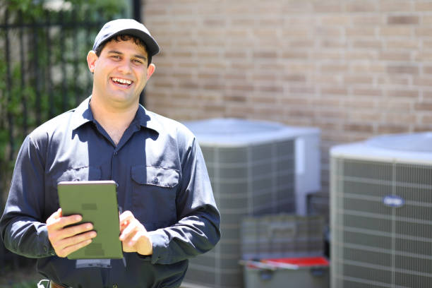istock Latin descent, blue collar air conditioner repairman at work. 1316667989