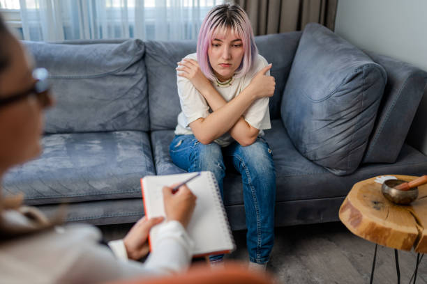 istock Therapist takes notes on a notepad as the woman explains her issues. 1316668288