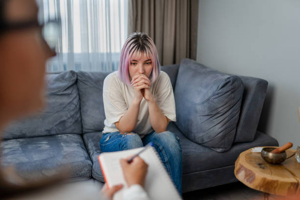 Hopeless Young woman talking with her Therapist Hopeless Young woman talking with her Therapist hopelessness photos stock pictures, royalty-free photos & images