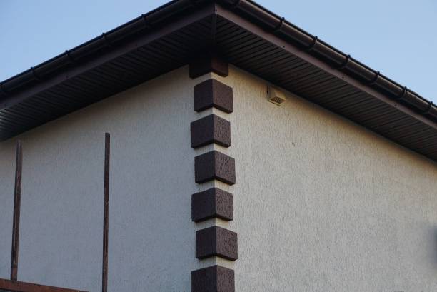 istock corner of gray concrete house with brown bricks 1316668630