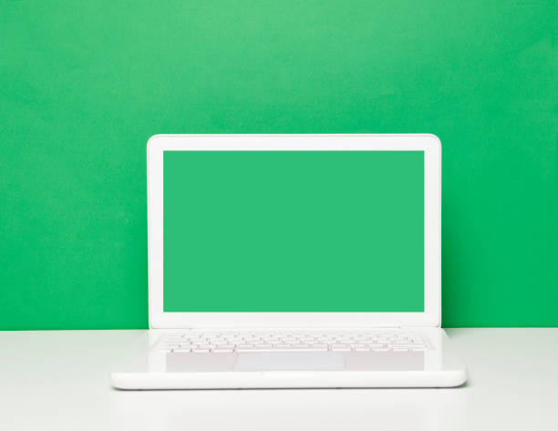 istock Green Screen Laptop On The Office Desk 1316672477