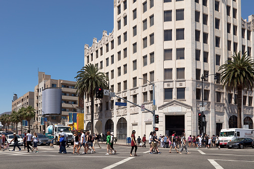 Pedestrians and tourist crossing street in Los Angeles, USA.