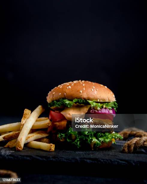 Closeup Of Hamburger With Black Background Stock Photo - Download Image Now - Burger, Black Background, Food