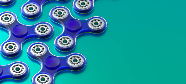 fidget spinners geïsoleerd op de achtergrond - handspinner stockfoto's en -beelden