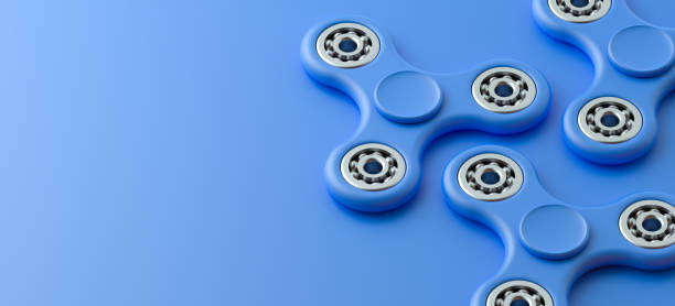 fidget spinners isoliert auf dem hintergrund - ball bearing wheel accuracy machine part stock-fotos und bilder