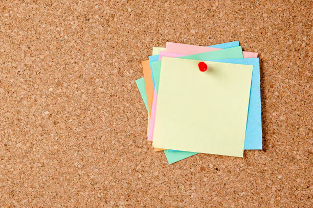 istock Cork board with a lot of pinned colored blank notes. 1316676076