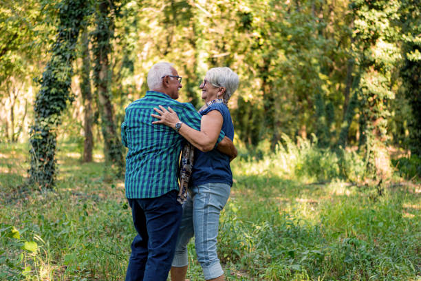 istock Senior  couple is dancing in the woods 1316677070