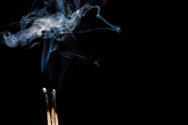 istock Smoke of an extinguished two matches on a black background 1316678489