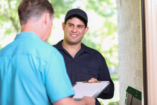 istock Latin descent repairman, technician makes house call at customer home. 1316679108