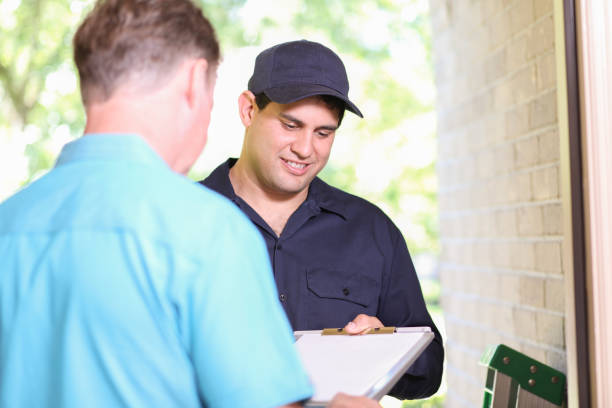 istock Latin descent repairman, technician makes house call at customer home. 1316679277