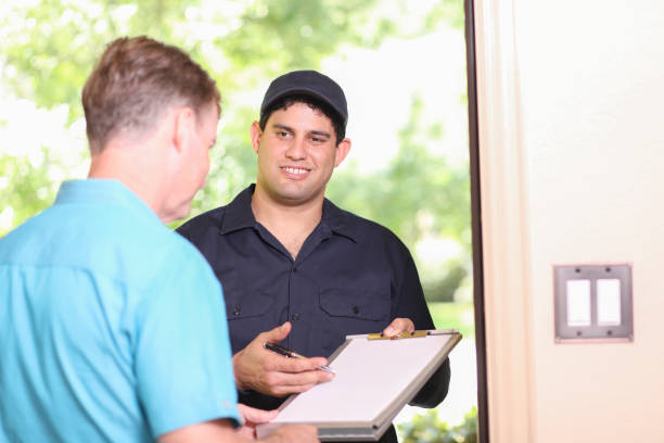 istock Latin descent repairman, technician makes house call at customer home. 1316679298