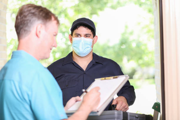 istock Latin descent repairman, technician makes house call at customer home. 1316679418