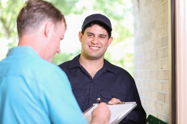 istock Latin descent repairman, technician makes house call at customer home. 1316679622
