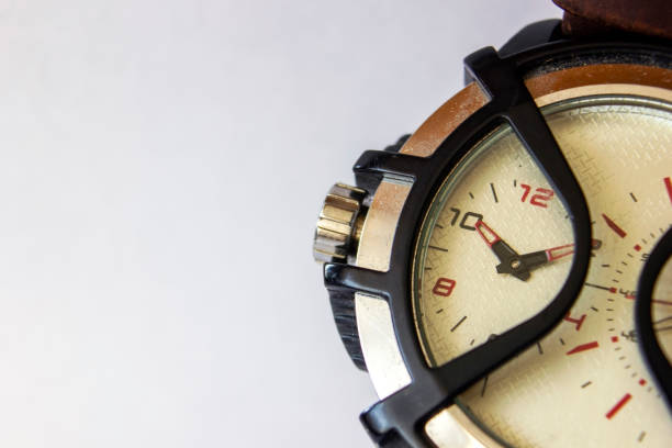 istock Macro shot of wrist watch with protective shield, Dial on a left to set the time by changing needle. Silver edge design of round watch 1316679648
