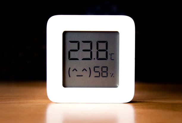 istock Digital temperature and humidity reading sensor device isolated on a black background 1316679655