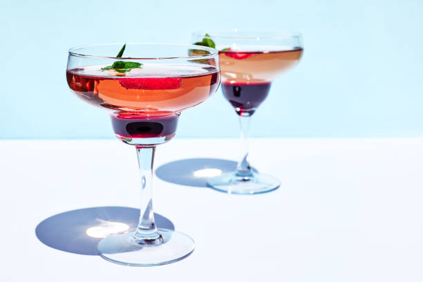 istock Fresh summer strawberry cocktail or mocktail on blue patel background. Creative drink beverage on sunlight with shadows 1316681508