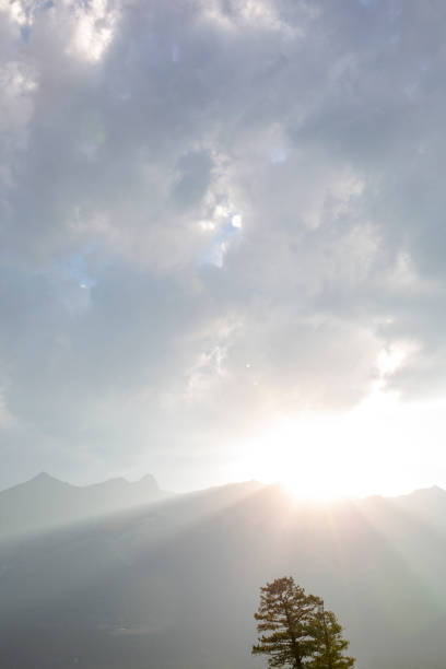 Sunlight shines over mountain ridge