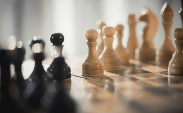 istock Wooden chess pieces on the chessboard. 1316681710