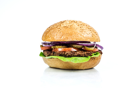 Burger with cheese lettuce tomato on a white background