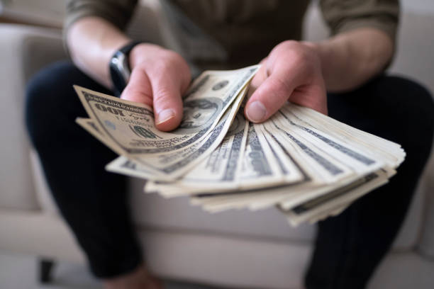 istock Counting Money Close Up 1316684101