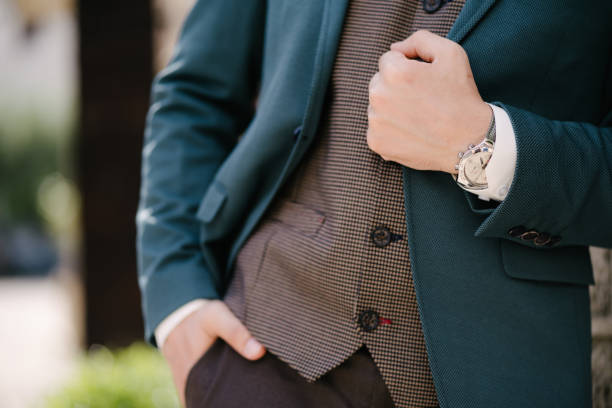 istock Groom holds his hand on the lapel of a blue jacket 1316684948