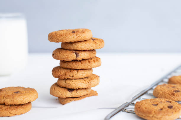 istock Biscuits with milk on wood background in the morning 1316685236