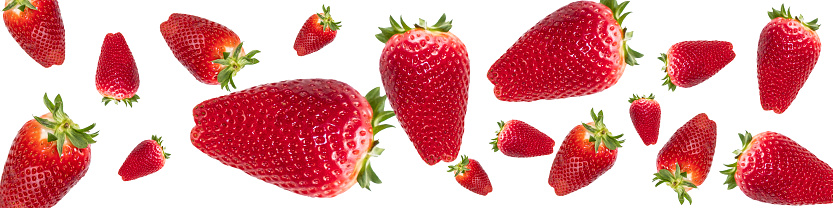 Red, ripe strawberries on a white background. Ripe berries, levitation. Banner, background photo.
