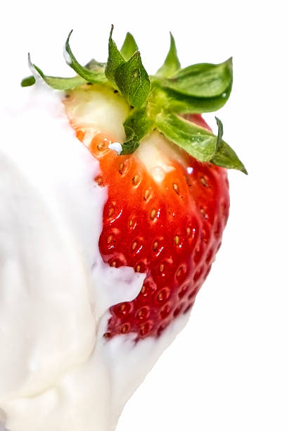 istock Red, juicy strawberries in cream. 1316685329