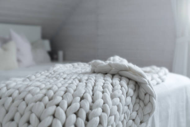 istock White nordic bedroom interior with knit plaid 1316687972