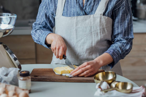 istock Unrecognizable Woman Preparing to Use Butter to Make Cookies 1316689997