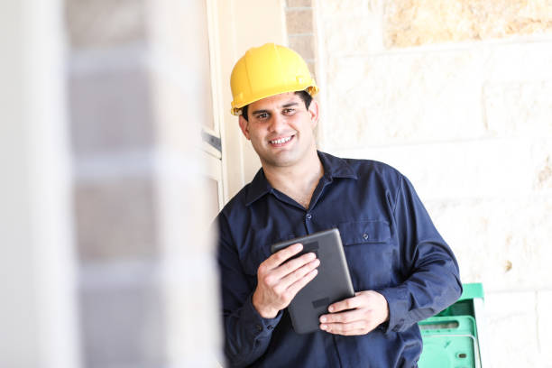 istock Latin descent man inspects home exterior. 1316691340