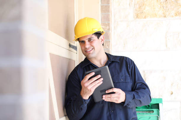 istock Latin descent man inspects home exterior. 1316691347