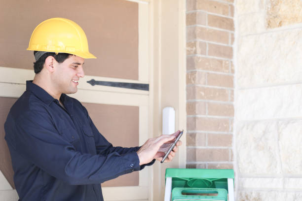 istock Latin descent man inspects home exterior. 1316691380