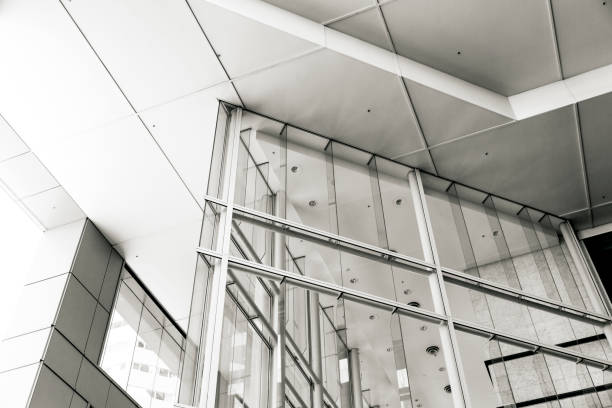 istock Closeup modern office building, low angle view, black and white, copy space 1316692335