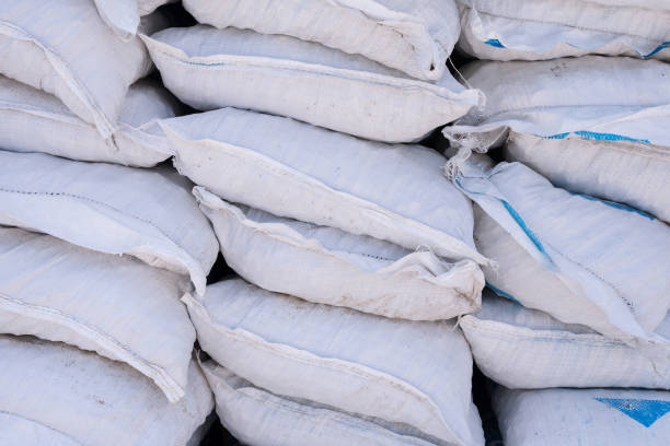 istock Stacks of cement bags, closeup 1316693982